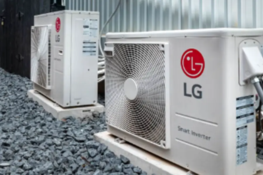 Two LG outdoor condensing units on gravel