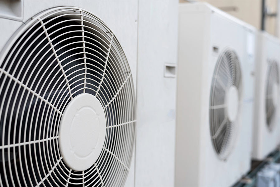 Close up of a row of outdoor condenser fans
